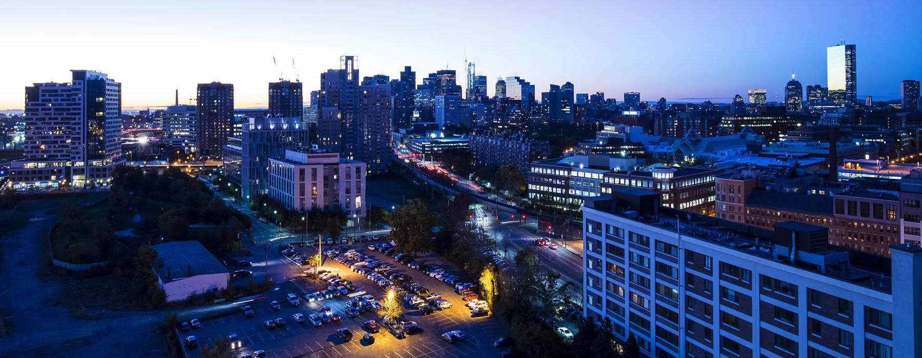 a city with buildings and streets at night