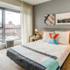 a bedroom with a large window